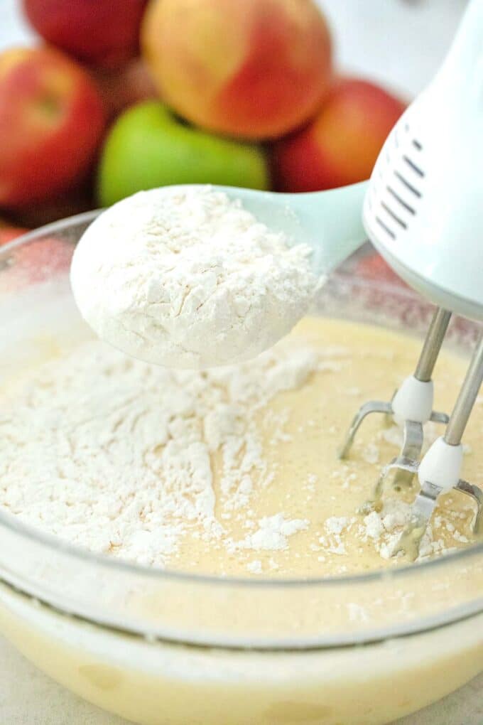 mixing in flour into batter into a large bowl