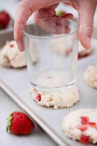 flattening strawberry shortcakes with a glass