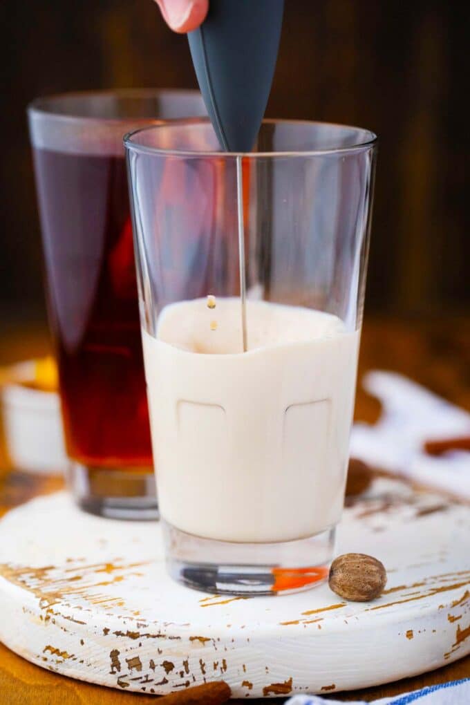 frothing milk with a milk frother