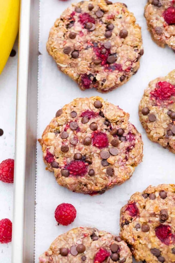 overhead shot of healthy raspberry cookies on a baking sheet