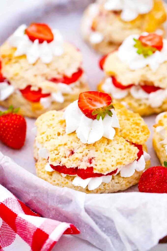 strawberry shortcakes on a wooden tray