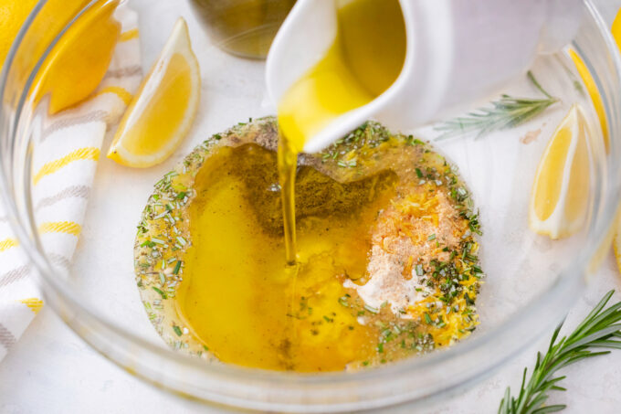 Making olive oil herby marinade for grilled potatoes.
