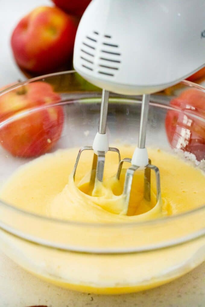 beating a mixture with a mixer into a large bowl
