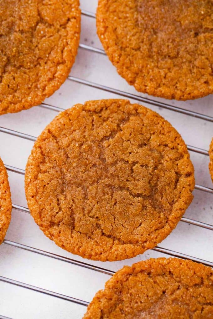 molasses cookies on a wire cooling rack