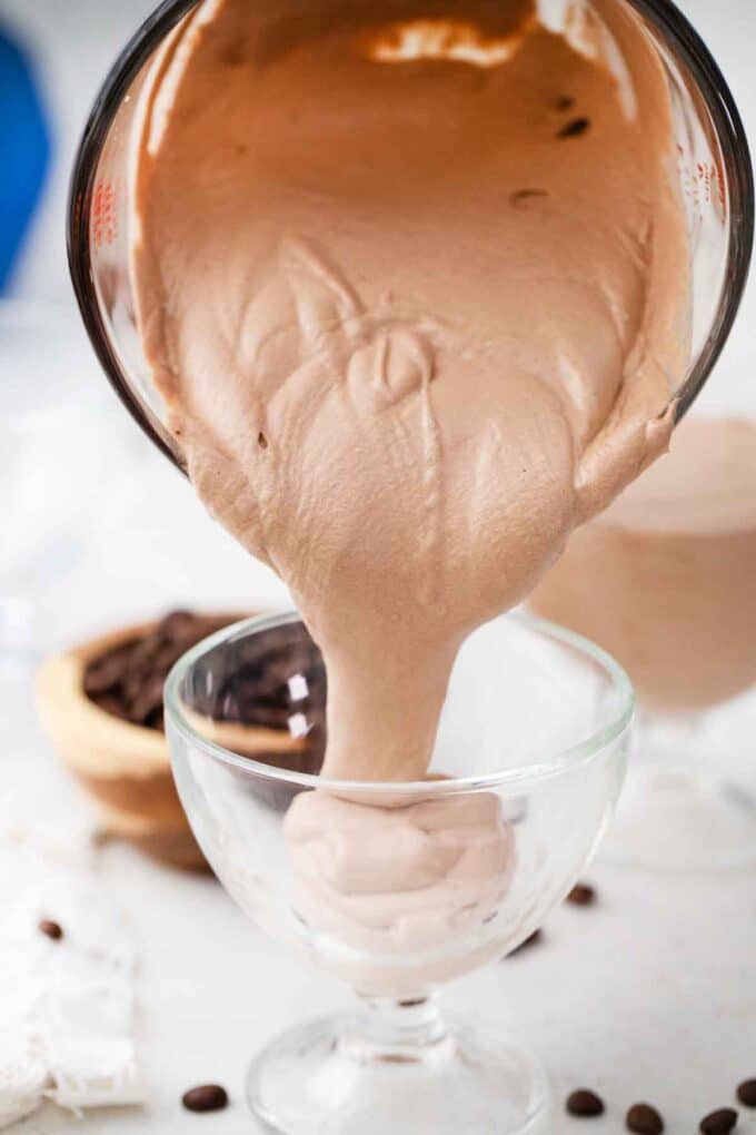 pouring protein coffee mousse into a ramekin