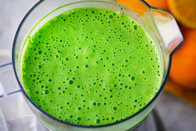 Spinach smoothie in a blender.