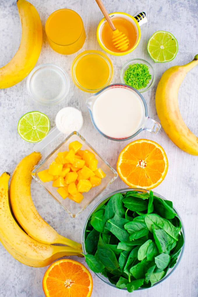 Overhead shot of spinach smoothie ingredients.