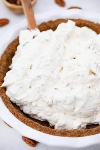 adding the pie filling to a gingersnap crust