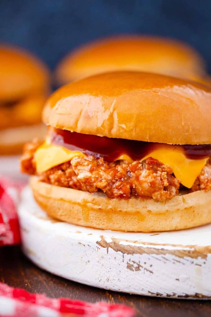 close shot of bbq turkey sloppy joes with melted cheddar cheese and bbq sauce