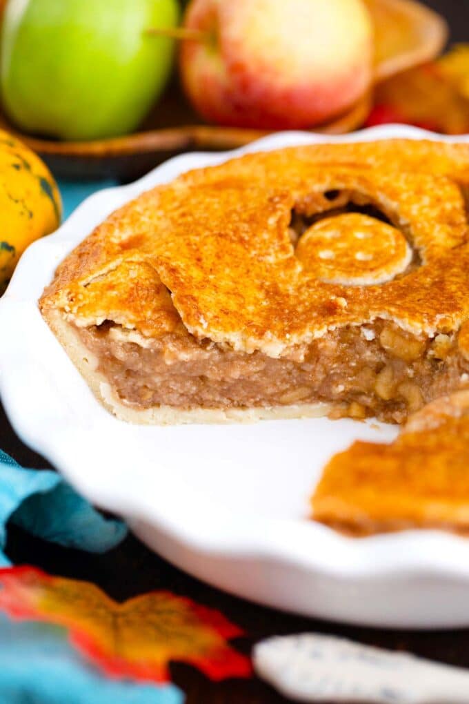 sliced halloween apple pie in the pie dish, revealing the apple pie filling
