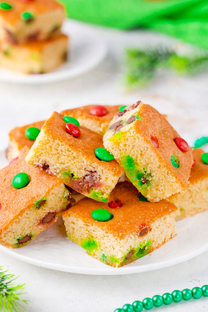 A plate of festive red and green m&m's cookie bars.