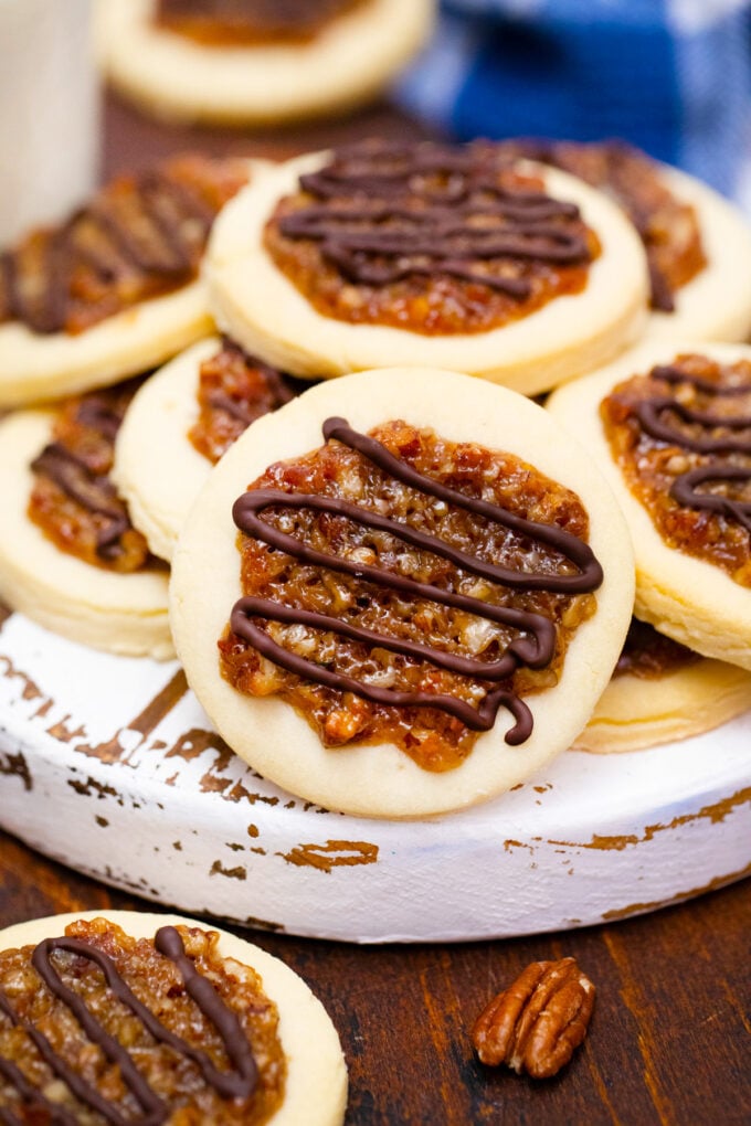 Homemade pecan pie cookies drizzled with chocolate.