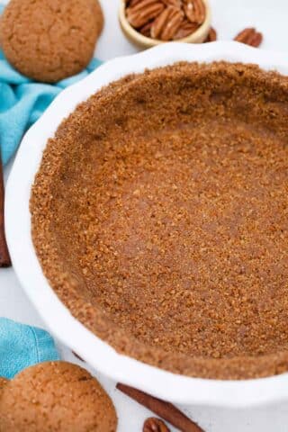 gingersnap crust in a white pie dish