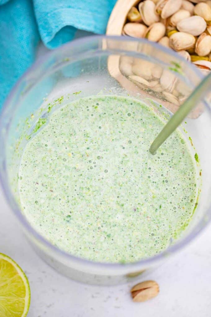 a green mixture in a blender