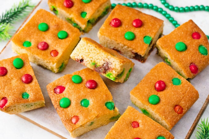 M&M's cookie bars on a cutting board.