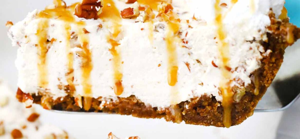 lifting from the pan a slice of no bake pecan cream pie