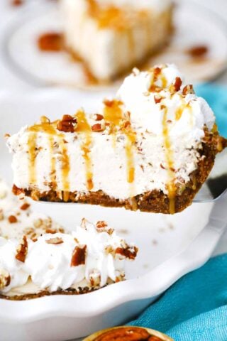 lifting from the pan a slice of no bake pecan cream pie