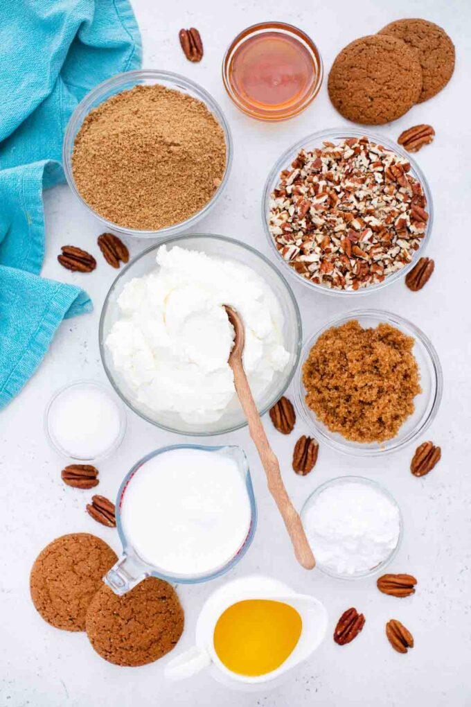 overhead shot of pecan cream pie ingredients in bowls on a white table