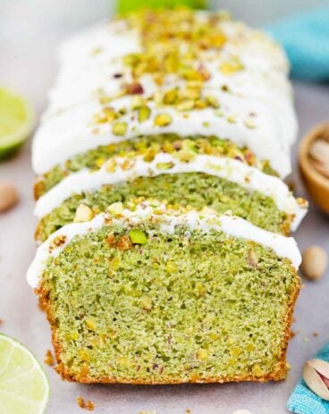 frontal shot of sliced green pistachio pound cake