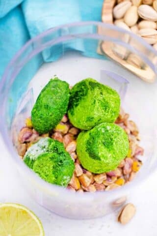 frozen spinach and pistachios in a food processor