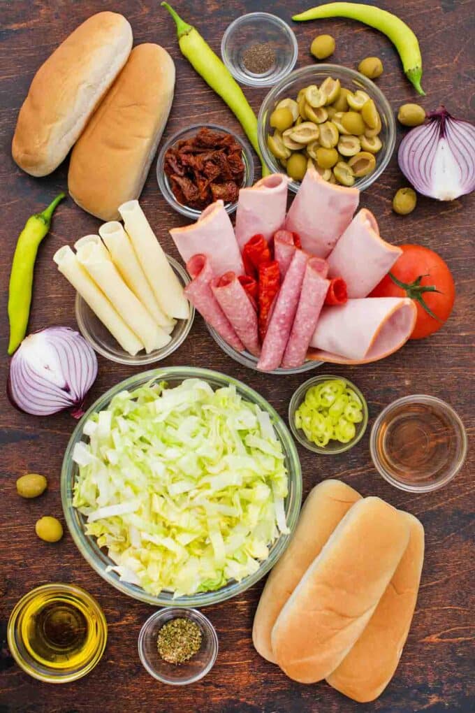 overhead shot of viral chopped italian sandwich ingredients in bowls on a table