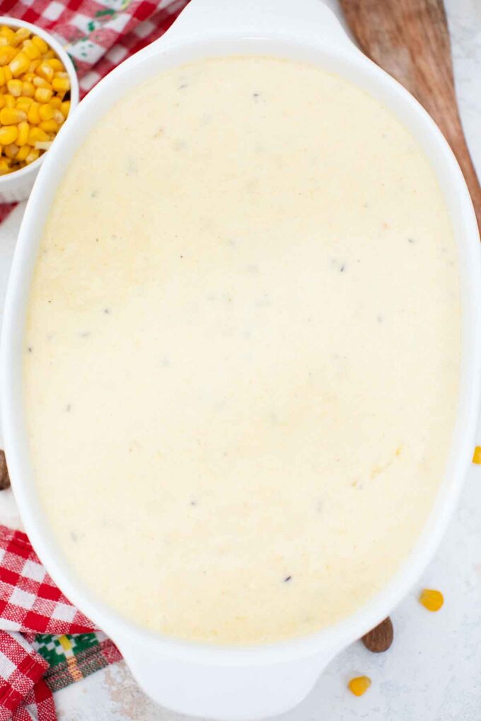 overhead shot of unbaked corn pudding casserole