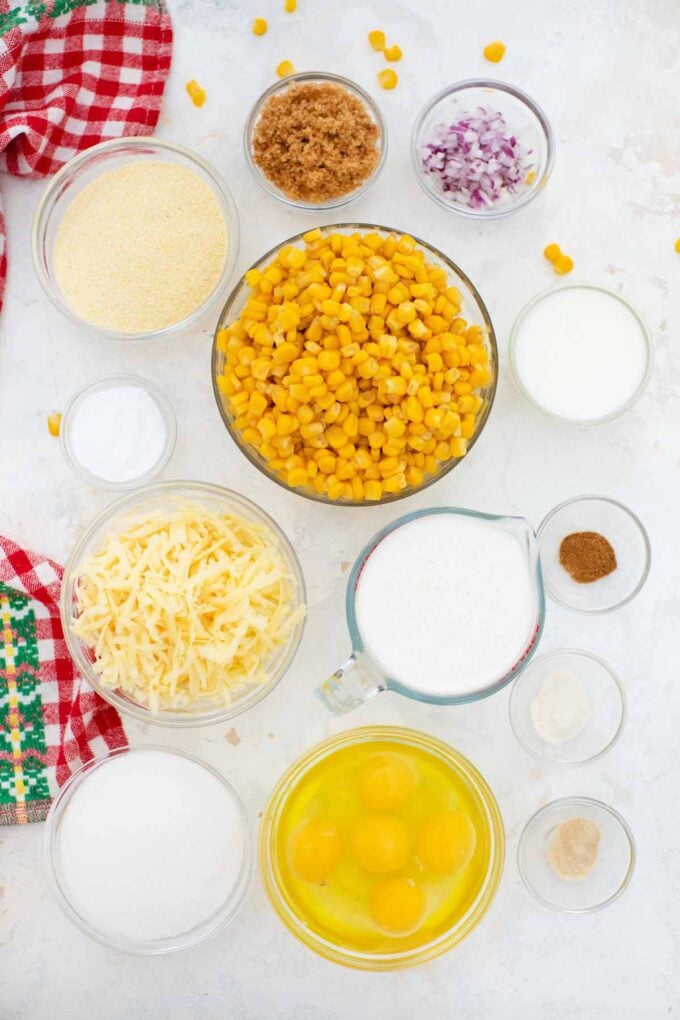 overhead shot of corn pudding casserole ingredients in bowls on a table