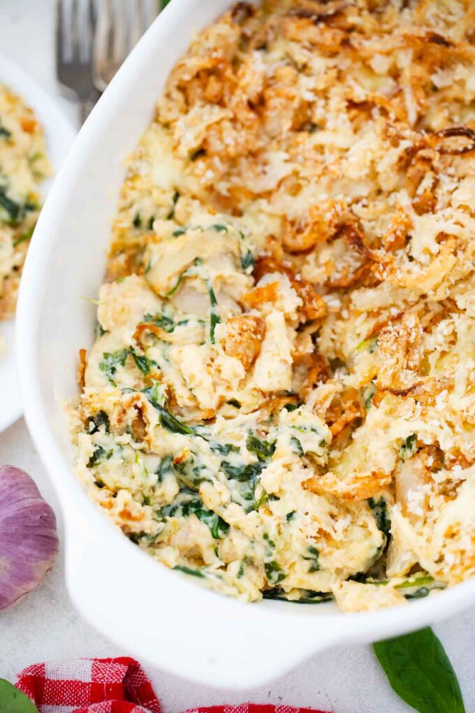 overhead shot of spinach casserole revealing its creamy layers and crunchy fried onion topping