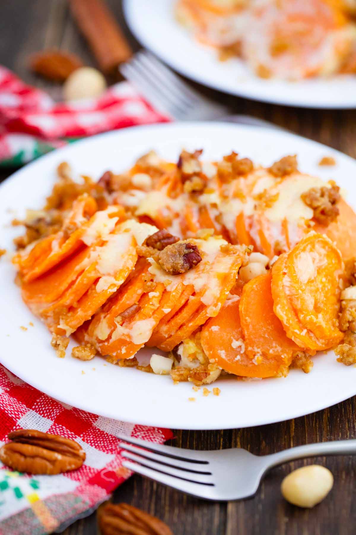 serving hasselback sweet potato casserole on a white plate