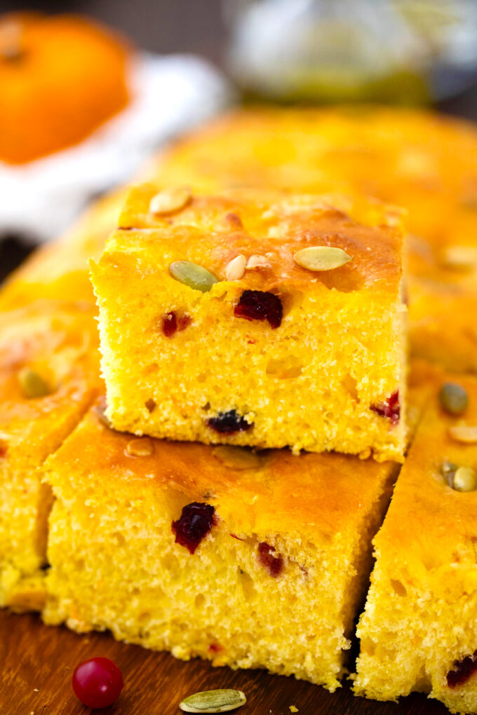 Fluffy cranberry pumpkin focaccia with pumpkin seeds.