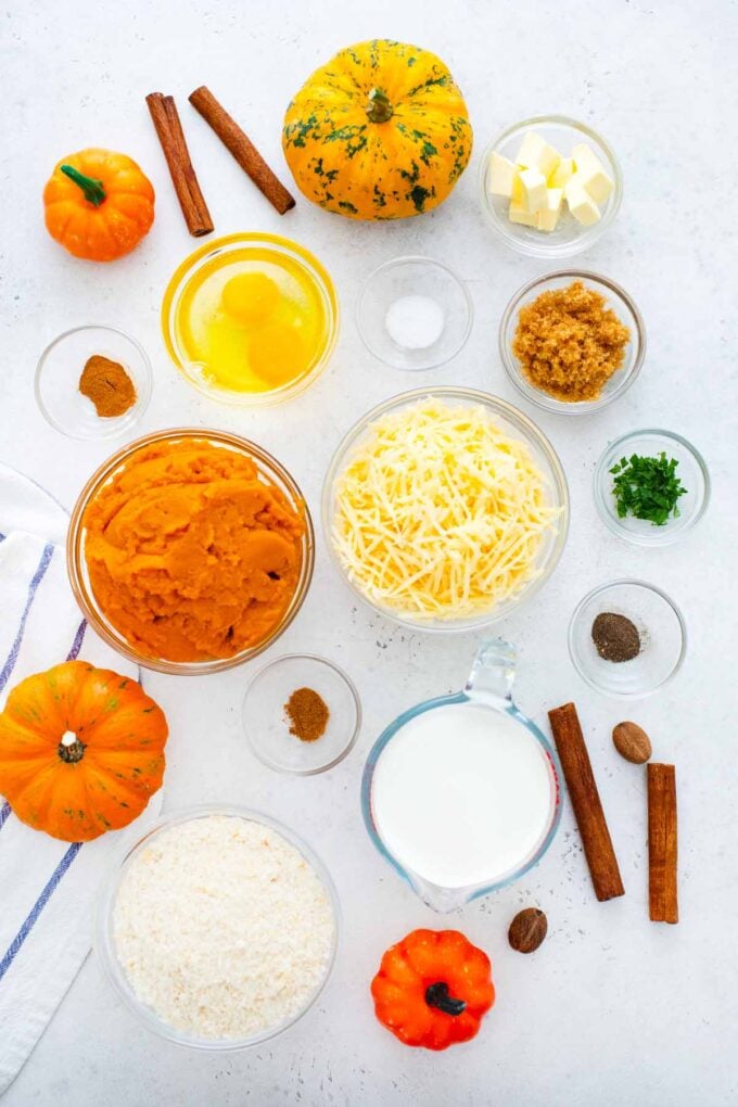 pumpkin gratin casserole ingredients in bowls on a table