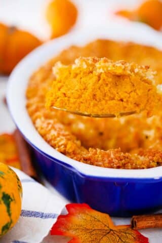 scooping a large spoonful go pumpkin gratin