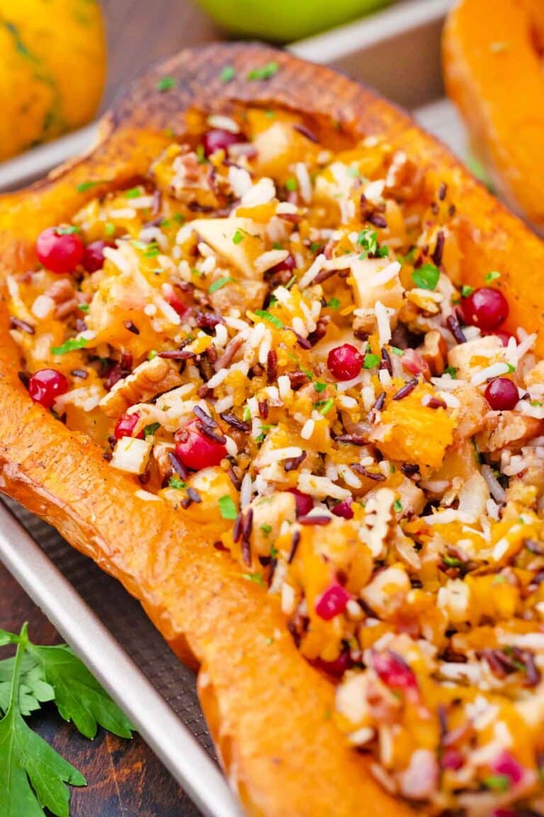 close shot of stuffed butternut squash on a baking sheet