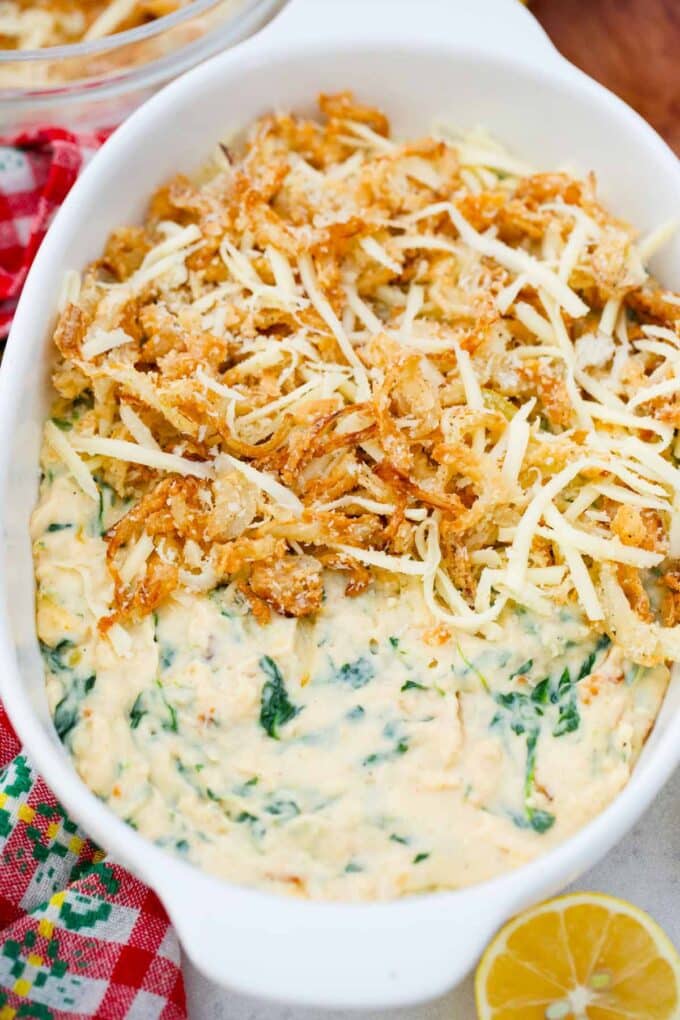 adding a layer of French fried onion on top of a layer of creamed spinach