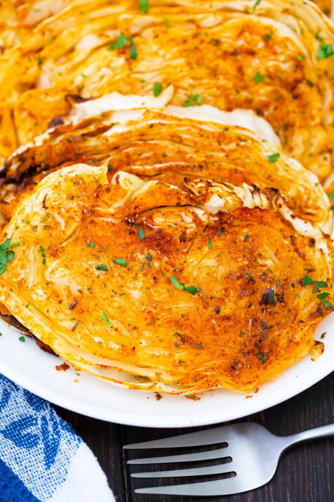 A serving plate of air fried cabbage steak.