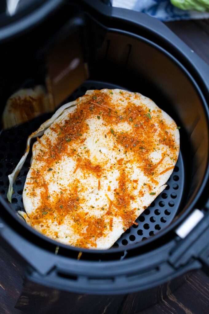 Cooking a cabbage steak in the air fryer.
