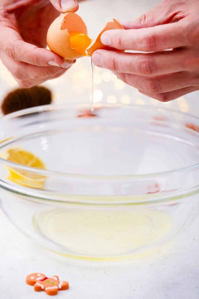 craving an egg on top of a large bowl with egg whites in it