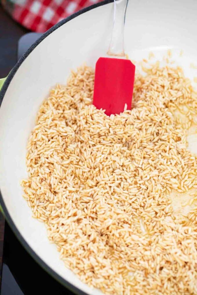 sautéing rice in a large skillet