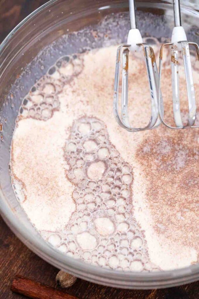 whisking milk and spices in a large bowl