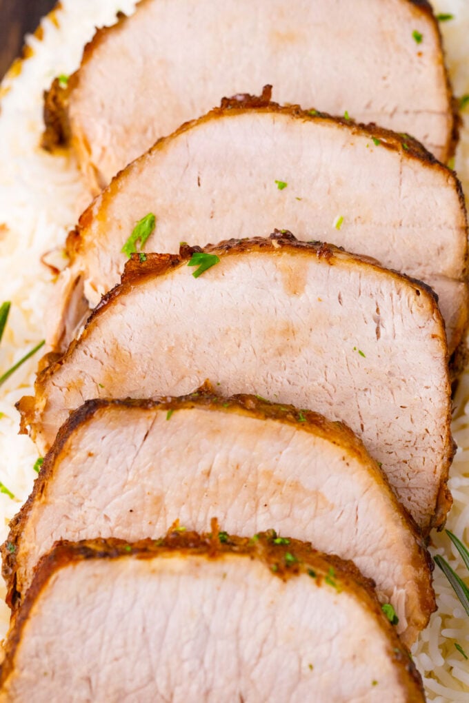 Slices of crockpot balsamic pork loin.