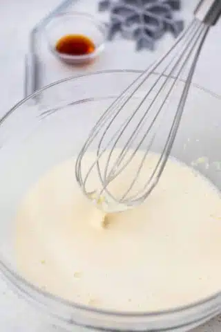 mixing batter for reset cookies with a whisk in a bowl