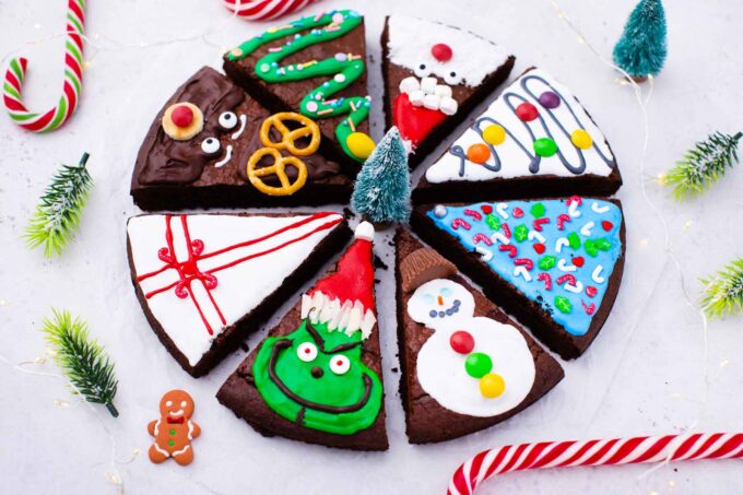 overhead shot of christmas brownie pops decorated in different festive ways