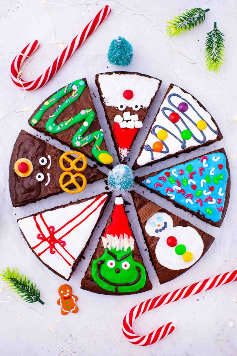 overhead shot of christmas brownie pops slices decorated as grinch Santa reindeer gift box christmas tree