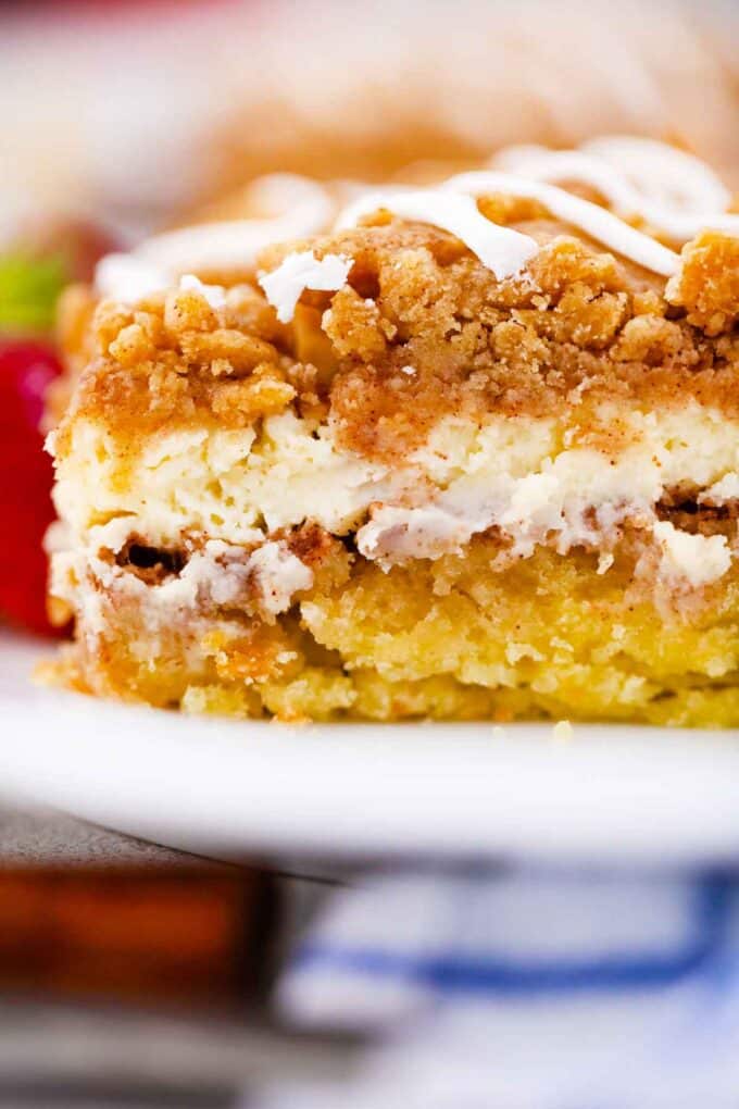 moist coffee cake with a cream cheese layer and buttery streusel topping