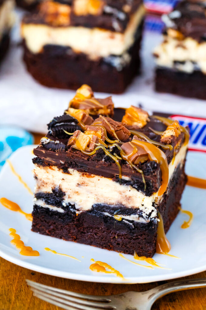 A slutty cheesecake brownie bar on a plate.