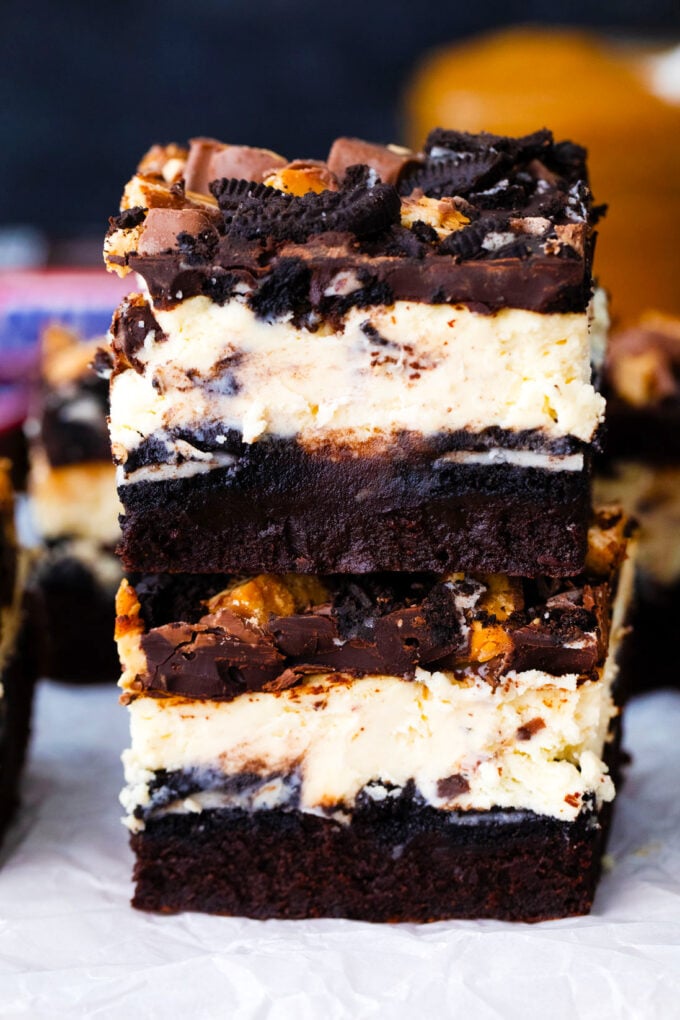 A stack of slutty cheesecake brownie bars.