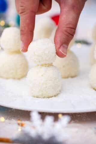 building a snowman from coconut truffles