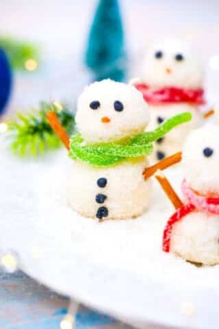 no bake snowman truffles with green and red candy scarfs
