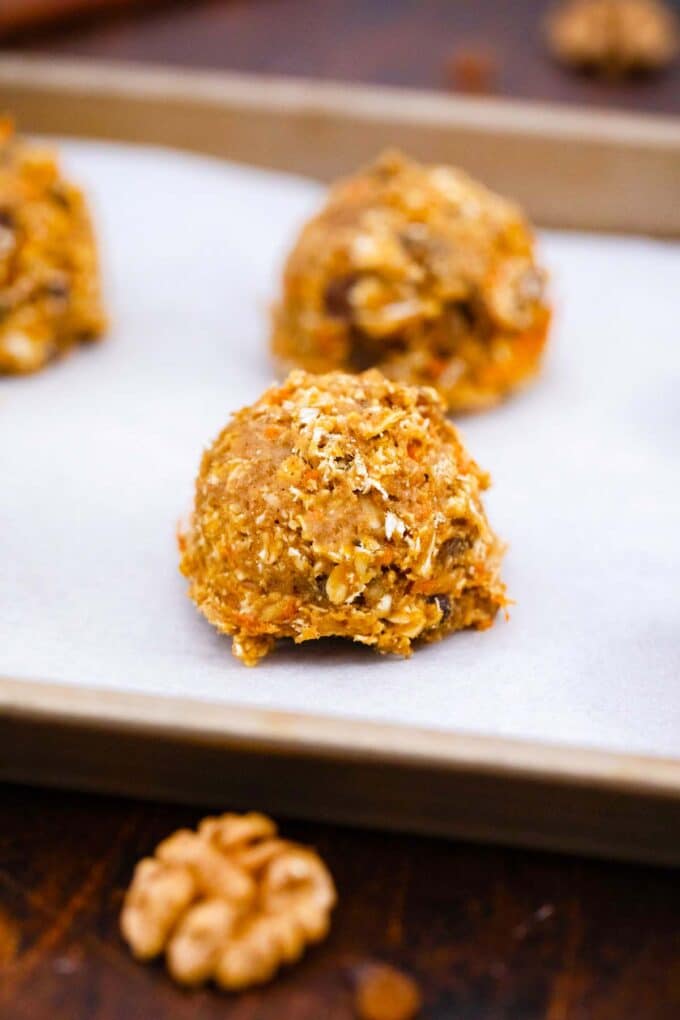 cookie dough balls on a baking sheet