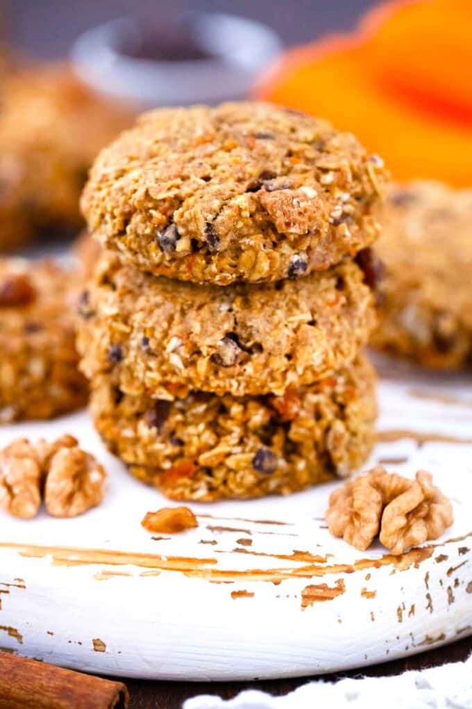 three carrot oatmeal cookies stacked on top of each other